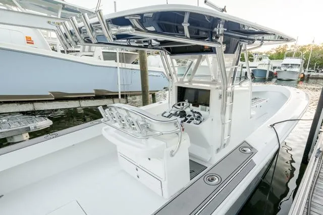  Yacht Photos Pics 2015 Bahama 34 boat docked, featuring sleek design and modern console.