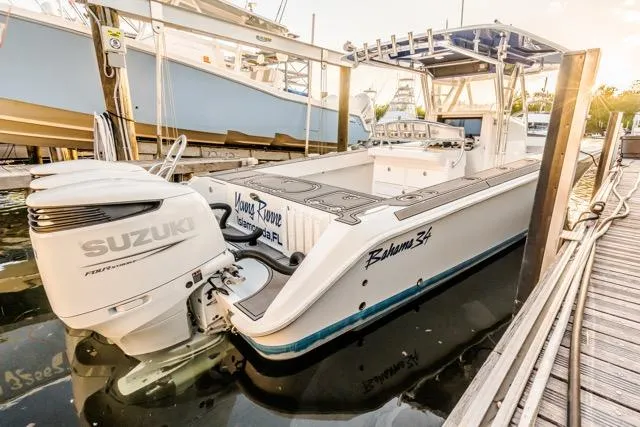  Yacht Photos Pics 2015 Bahama 34 boat with Suzuki engine docked at marina.