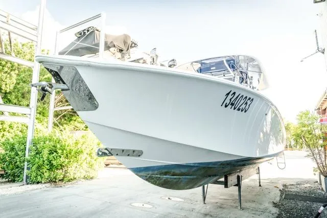  Yacht Photos Pics 2015 Bahama 34 boat on dry dock, white hull, registration number visible.