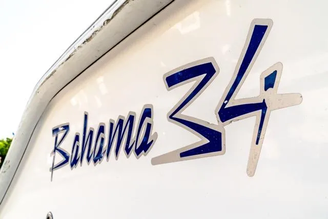  Yacht Photos Pics Close-up of 2015 Bahama 34 boat logo on white surface.