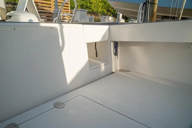  Yacht Photos Pics 2015 Bahama 34 boat interior with clean, spacious deck and storage compartments.