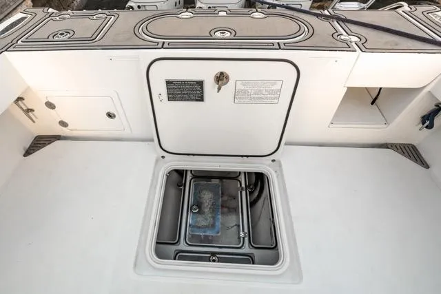  Yacht Photos Pics 2015 Bahama 34 boat deck with open storage compartment.