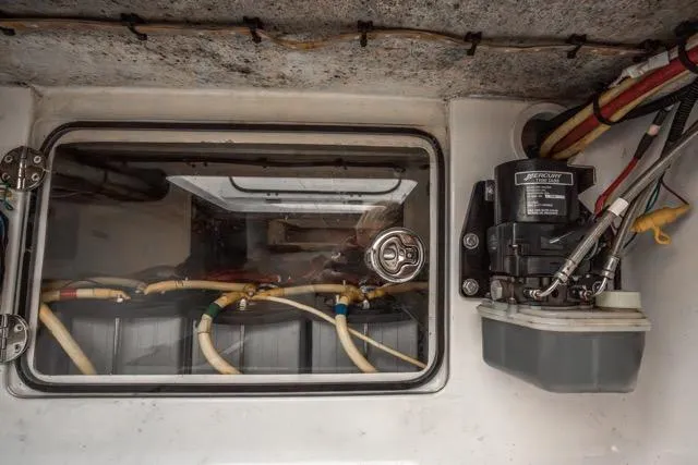  Yacht Photos Pics Engine compartment of 2015 Bahama 34 boat with visible wiring and components.