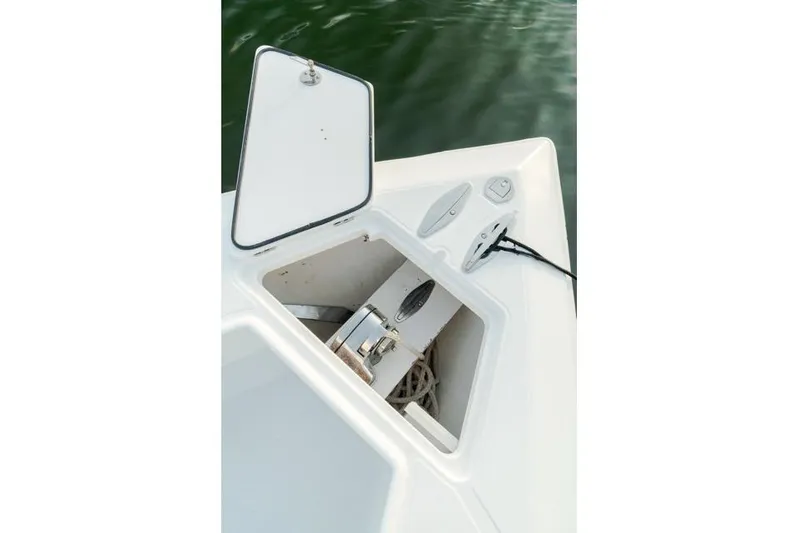  Yacht Photos Pics Open anchor compartment on 2015 Bahama 34 boat, showing anchor and rope storage.