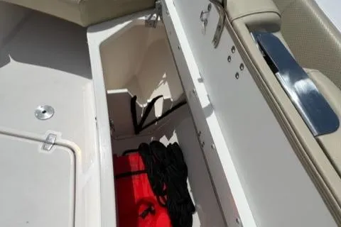  Yacht Photos Pics Open storage compartment on 2019 Pursuit S408 boat with red and black gear.
