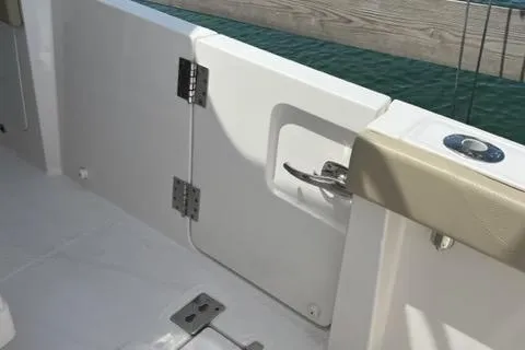  Yacht Photos Pics 2019 Pursuit S408 boat interior with open side door and beige seating.