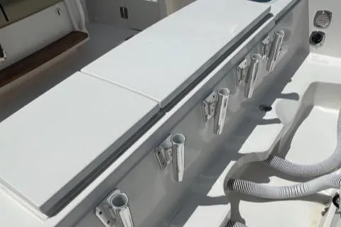  Yacht Photos Pics 2019 Pursuit S408 boat deck with rod holders and storage compartments.