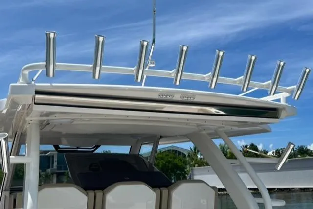  Yacht Photos Pics 2019 Pursuit S408 boat with rod holders against a clear blue sky.