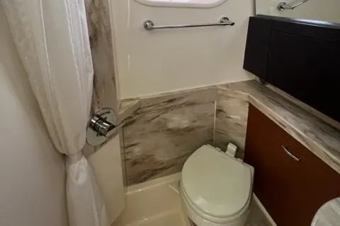  Yacht Photos Pics 2019 Pursuit S408 bathroom with modern fixtures and compact design.