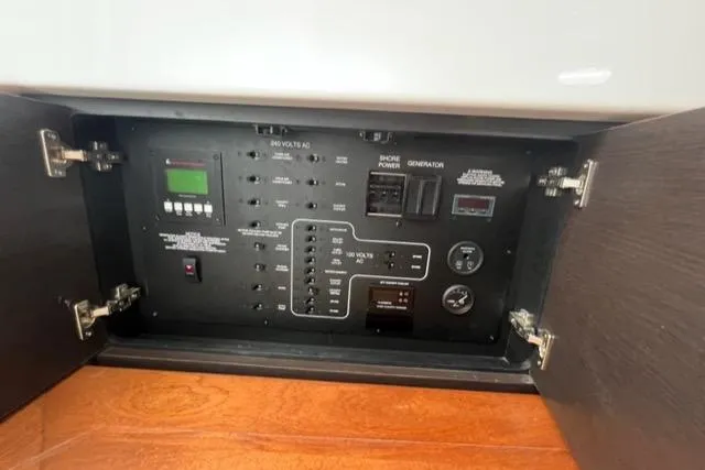  Yacht Photos Pics Electrical control panel inside 2019 Pursuit S408 boat, featuring switches and gauges.