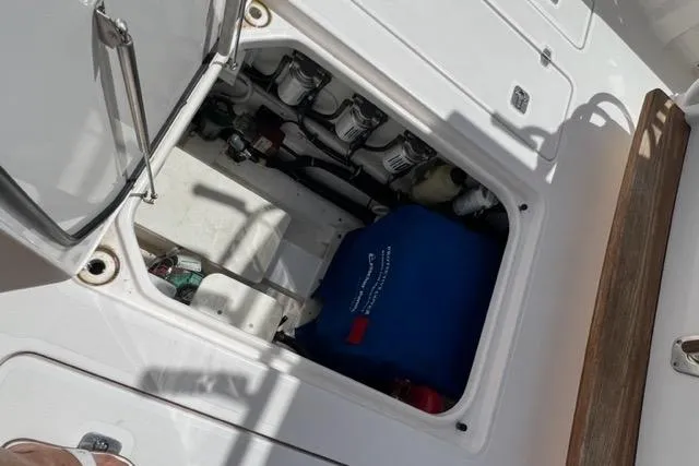 Yacht Photos Pics Open hatch on 2019 Pursuit S408 boat showing internal storage compartment.