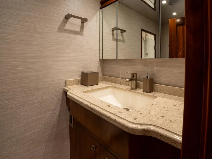 Reel Cents Yacht Photos Pics Luxurious bathroom in 2019 Viking 80 Enclosed Bridge yacht with elegant fixtures and modern design.