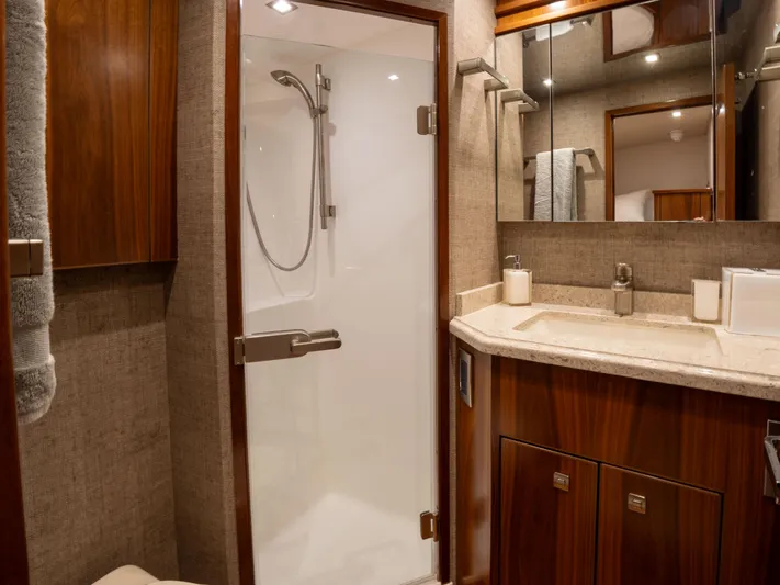 Reel Cents Yacht Photos Pics Luxurious bathroom in 2019 Viking 80 Enclosed Bridge yacht with modern shower and vanity.