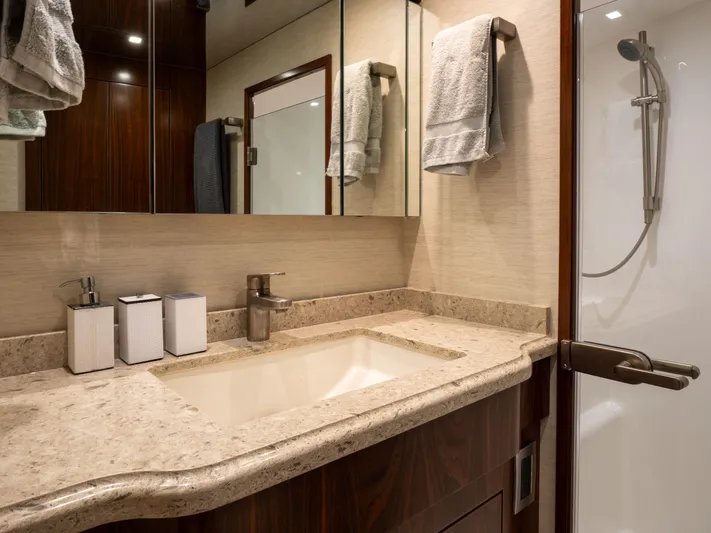 Reel Cents Yacht Photos Pics Luxurious bathroom in 2019 Viking 80 Enclosed Bridge yacht with modern fixtures.