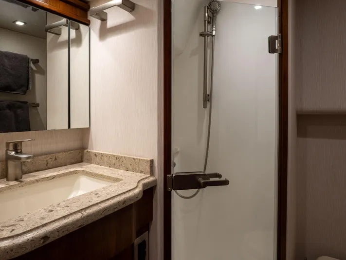 Reel Cents Yacht Photos Pics Luxurious bathroom in 2019 Viking 80 Enclosed Bridge yacht with modern shower and vanity.