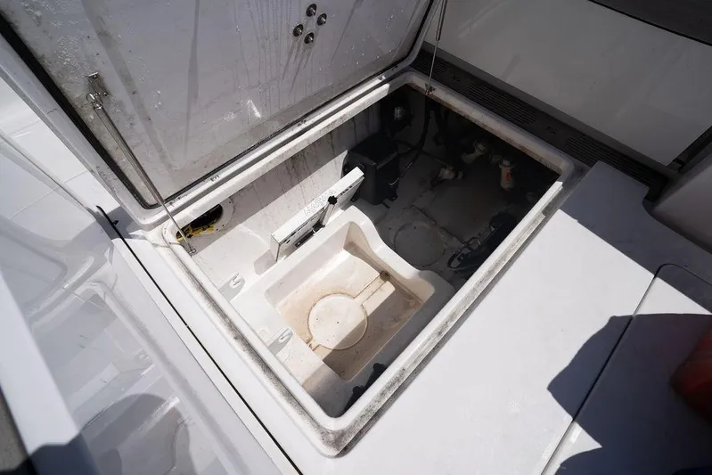 Change Clothes Yacht Photos Pics Open storage compartment on 2023 Sportsman Open 322 Center Console boat.