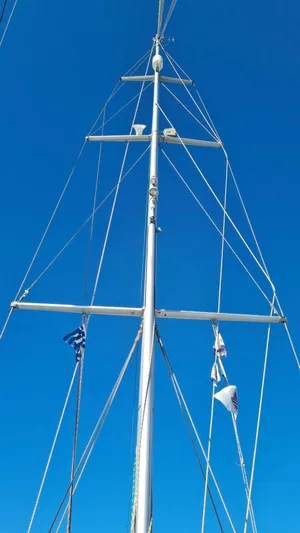 Surfing Safari Yacht Photos Pics Mast of 2010 Hallberg-Rassy 40 sailboat against clear blue sky.