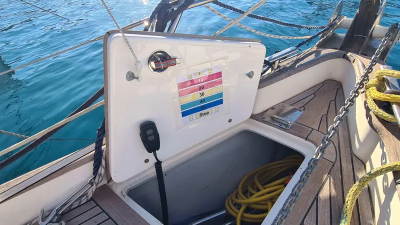 Surfing Safari Yacht Photos Pics Hallberg-Rassy 40 sailboat deck with open hatch, ropes, and control panel, 2010 model.