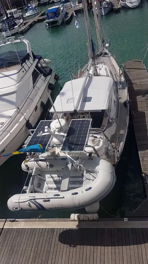 Surfing Safari Yacht Photos Pics 2010 Hallberg-Rassy 40 sailboat docked with inflatable dinghy and solar panels.