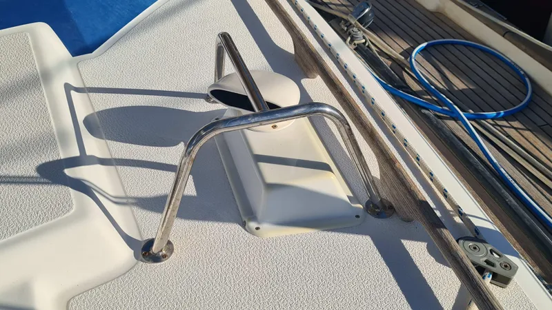 Surfing Safari Yacht Photos Pics Deck of 2010 Hallberg-Rassy 40 sailboat with stainless steel fittings and blue rope.