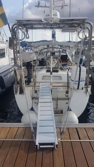 Surfing Safari Yacht Photos Pics 2010 Hallberg-Rassy 40 yacht docked with gangway, rear view.