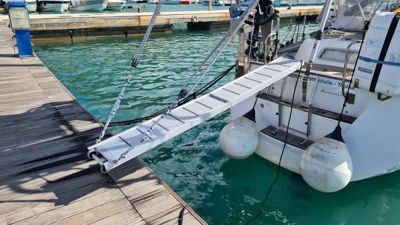 Surfing Safari Yacht Photos Pics Hallberg-Rassy 40 yacht with gangway, docked at marina, 2010 model.