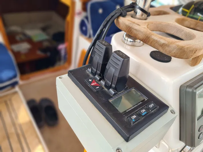 Surfing Safari Yacht Photos Pics Control panel on a 2010 Hallberg-Rassy 40 sailboat, featuring switches and a digital display.