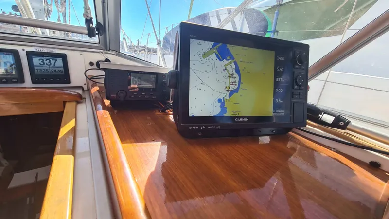 Surfing Safari Yacht Photos Pics Navigation equipment on a 2010 Hallberg-Rassy 40 sailboat, featuring a Garmin GPS display.