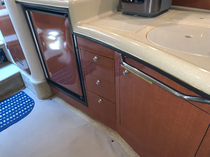 Tbd Yacht Photos Pics Interior of 2002 Sea Ray 340 Sundancer showing kitchen cabinetry and countertop.