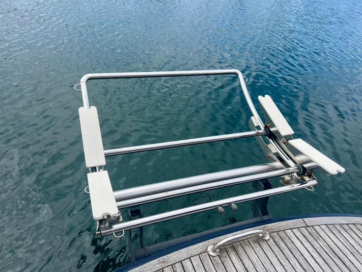 "lexi Lu" Yacht Photos Pics Stainless steel boat ladder on Elling E4 yacht, 2008, over calm water.