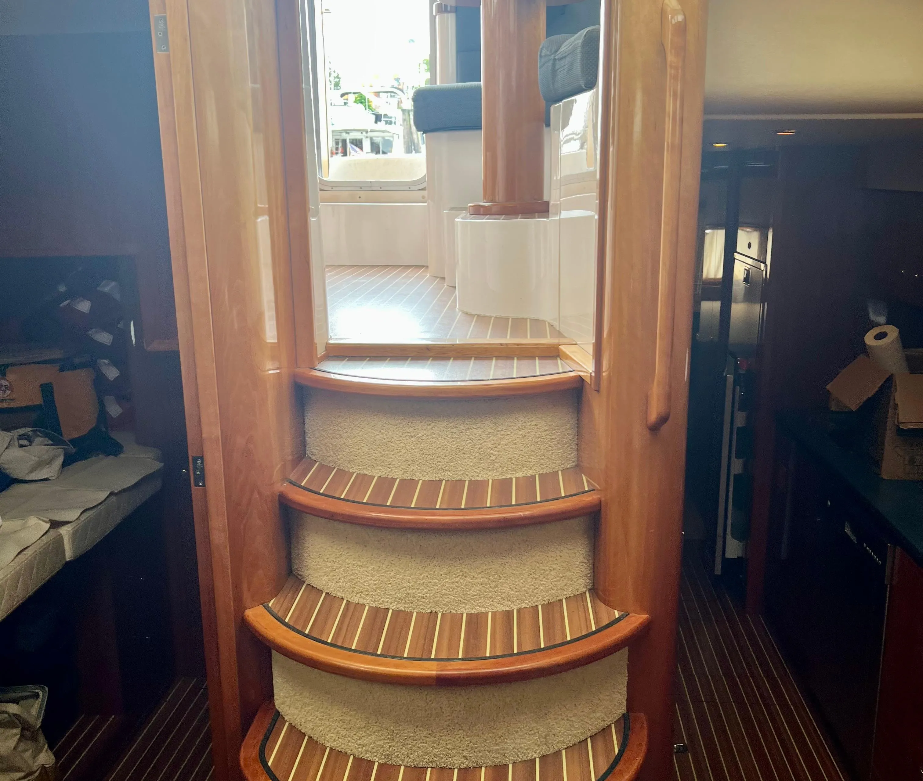 Interior of 2008 Elling E4 yacht with wooden stairs and elegant cabin design.