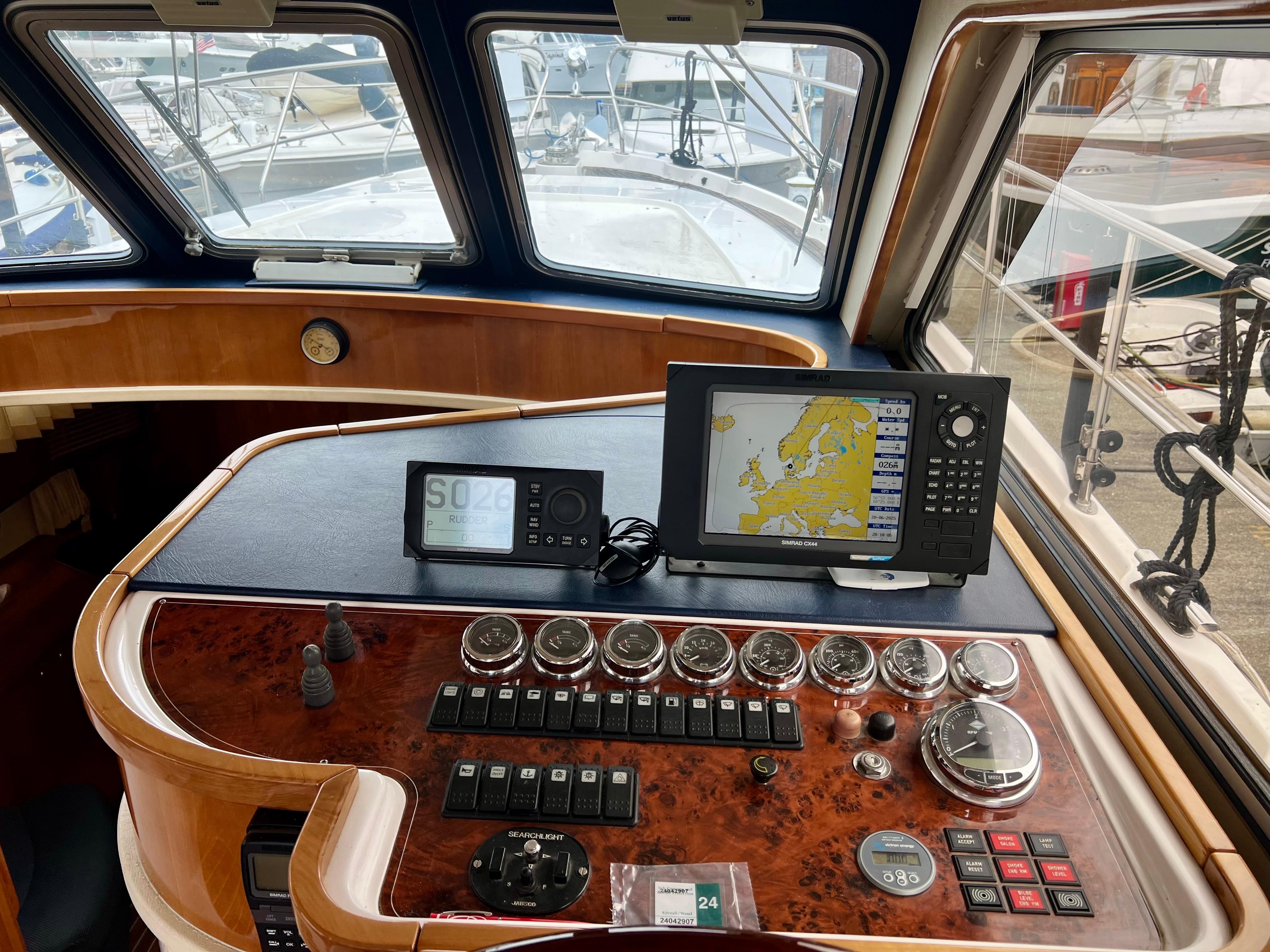 Control panel of a 2008 Elling E4 yacht with navigation equipment and gauges.