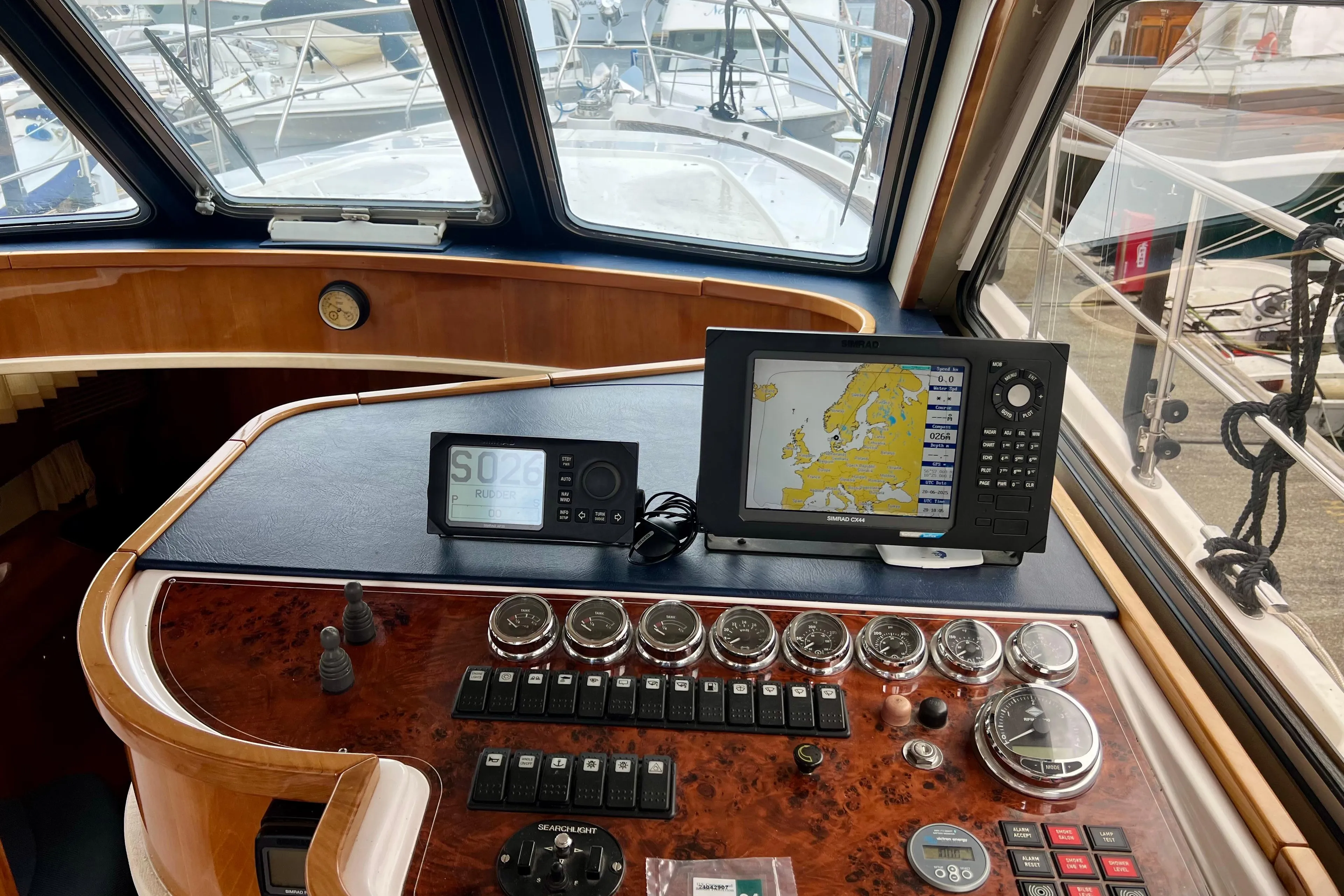 Control panel of a 2008 Elling E4 yacht with navigation equipment and gauges.
