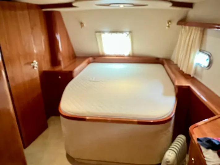 "lexi Lu" Yacht Photos Pics Luxurious cabin interior of 2008 Elling E4 yacht with cozy bed and wooden furnishings.