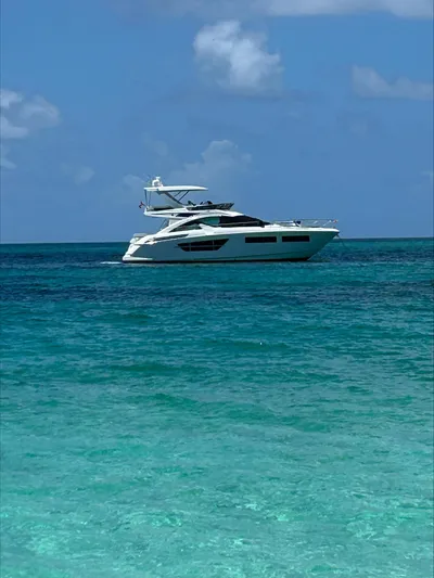 Rio Yacht Photos Pics Luxury 2017 Cruisers Yachts 60 Fly on clear blue ocean waters.