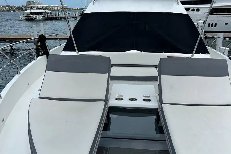 Rio Yacht Photos Pics Luxurious 2017 Cruisers Yachts 60 Fly with sun loungers, docked at marina.