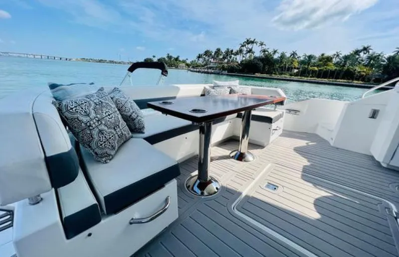 Rio Yacht Photos Pics Luxurious 2017 Cruisers Yachts 60 Fly deck with elegant seating and scenic water view.