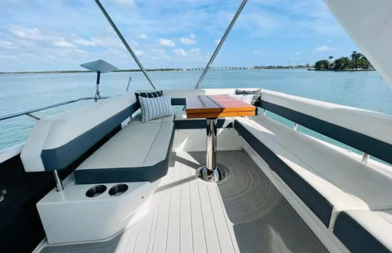Rio Yacht Photos Pics Luxurious seating area on 2017 Cruisers Yachts 60 Fly, overlooking serene waters.