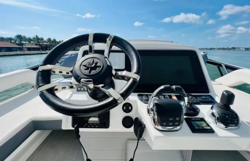 Rio Yacht Photos Pics Steering wheel and controls of 2017 Cruisers Yachts 60 Fly on a sunny day.