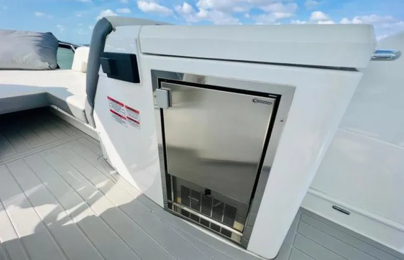 Rio Yacht Photos Pics 2017 Cruisers Yachts 60 Fly deck with stainless steel fridge and seating area.