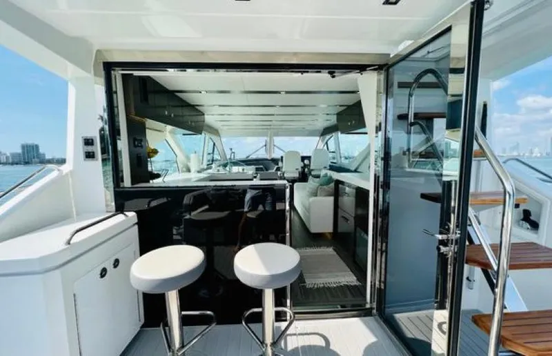 Rio Yacht Photos Pics Luxurious 2017 Cruisers Yachts 60 Fly interior with modern seating and panoramic views.