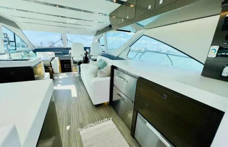 Rio Yacht Photos Pics Luxurious interior of 2017 Cruisers Yachts 60 Fly with modern furnishings and panoramic windows.