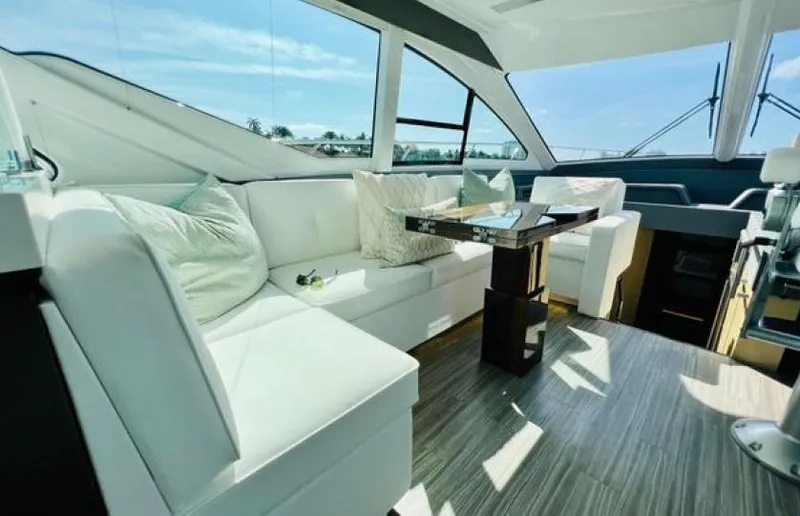Rio Yacht Photos Pics Luxurious interior of 2017 Cruisers Yachts 60 Fly with white seating and modern decor.