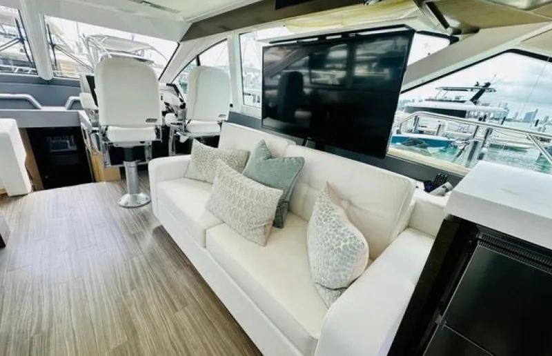 Rio Yacht Photos Pics Luxurious interior of 2017 Cruisers Yachts 60 Fly with sofa and helm chairs.