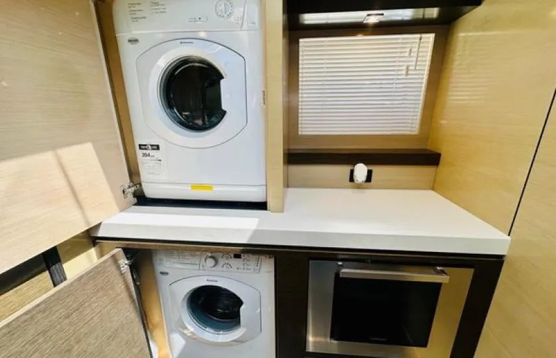 Rio Yacht Photos Pics Laundry area with washer and dryer inside 2017 Cruisers Yachts 60 Fly.