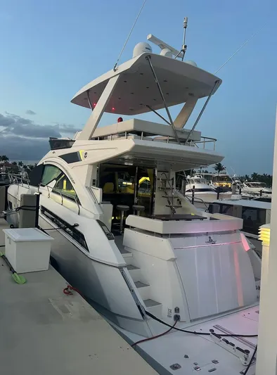 Rio Yacht Photos Pics 2017 Cruisers Yachts 60 Fly at dock, showcasing sleek design and spacious flybridge.