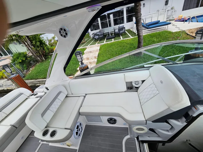  Yacht Photos Pics Luxurious 2022 Regal 33 XO boat interior with plush seating and modern design.