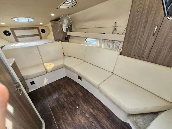  Yacht Photos Pics Luxurious interior of 2022 Regal 33 XO boat with beige seating and wood accents.