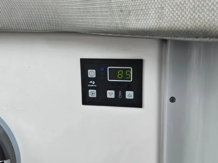  Yacht Photos Pics Control panel on 2022 Regal 33 XO boat displaying temperature settings.