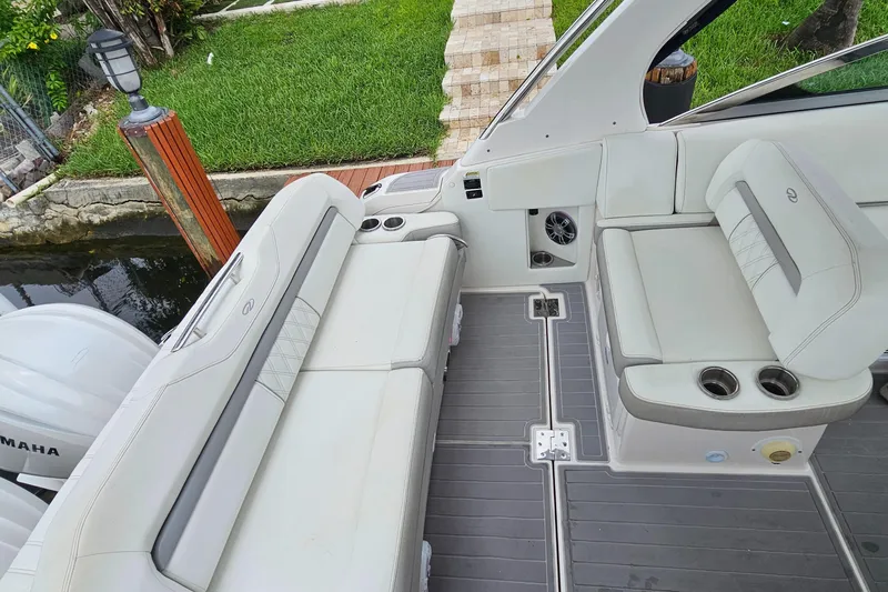  Yacht Photos Pics 2022 Regal 33 XO boat interior with white seating and deck view.